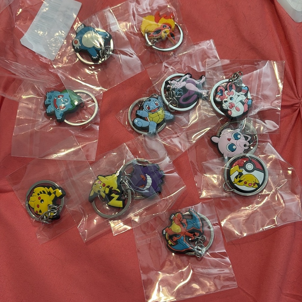 Pokémon key chains, 12 in each pack. Brand new in bag!